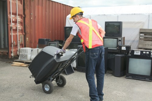 Office furniture and storage items being cleared from a workplace